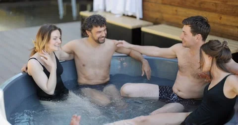 Friends having fun bathing at spa outdoors Stock Footage 154829580