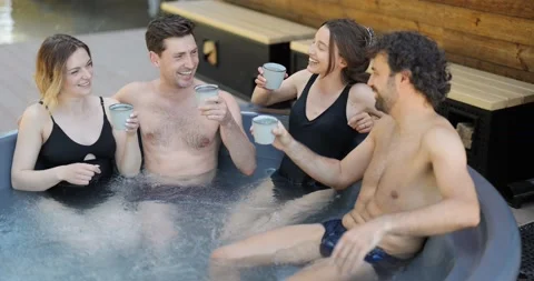 Friends having fun bathing at spa outdoors Stock Footage 154829695