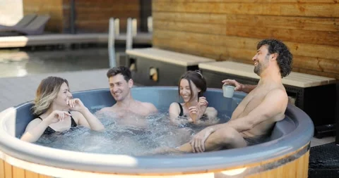 Friends having fun bathing at spa outdoors Stock Footage 154829807