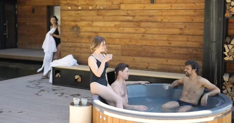 Friends having fun bathing at spa outdoors Stock Footage 154830709