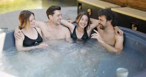 Friends having fun bathing at spa outdoors Stock Footage 154830829