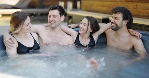 Friends having fun bathing at spa outdoors Stock Footage 154830907