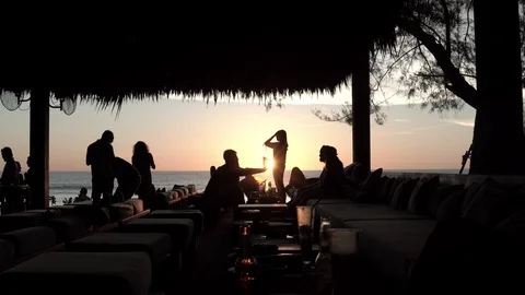 Friends having fun on the beach party during the sunset time Stock Footage 125812294