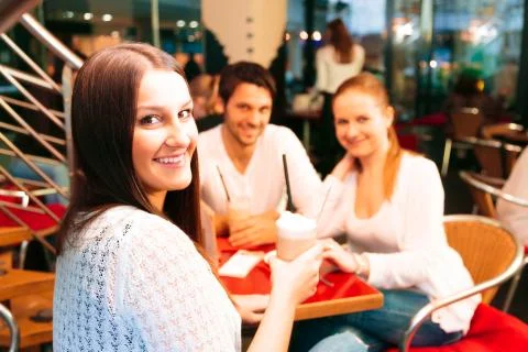 Friends Having Fun At A Cafe 写真素材