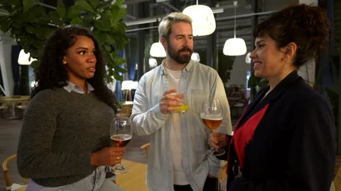 Friends having fun drinking beer chatting on a night bar Stock Footage 297351953