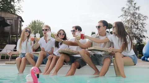 Friends having fun to enjoy their summer vacation together in swimming poolside Stock Footage 150212528