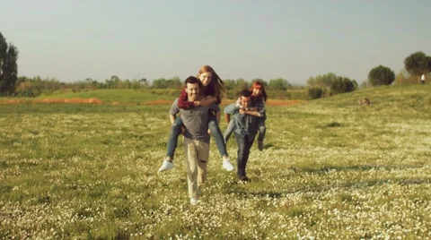 Friends having fun in the park Stock Footage 62777139