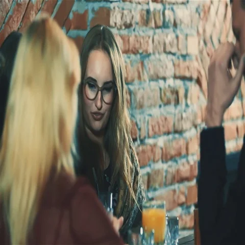 Friends having fun at party bar HD slow motion video. Women and people laughing Stock Footage 69487022