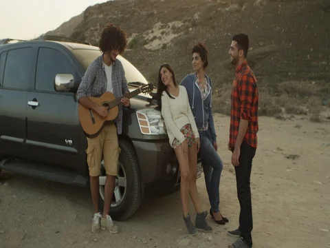 Friends having fun playing a guitar. Stock Footage 69468432