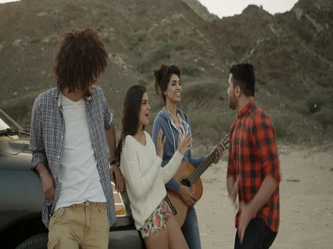 Friends having fun playing a guitar. Stock Footage 69469505