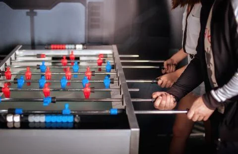 Friends having fun playing table foosball Stock-Fotos