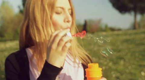 Friends having fun with soap bubbles Stock Footage 62776988