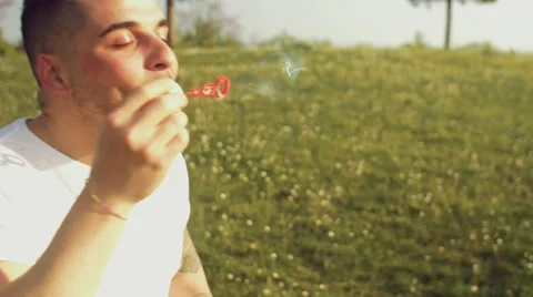 Friends having fun with soap bubbles Stock Footage 62776989