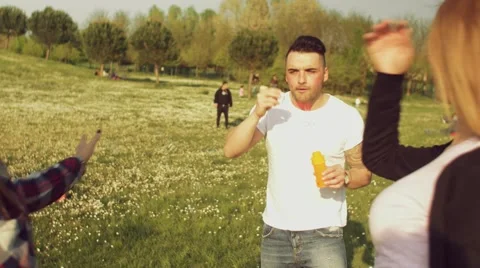 Friends having fun with soap bubbles Stock Footage 62777024