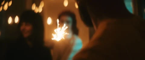 Friends having fun with sparkler during new years eve Video stock 202258217