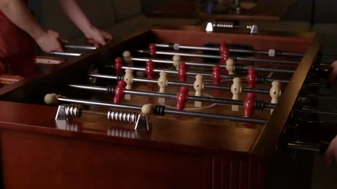 Friends having fun together playing table football. Stock Footage 88523872