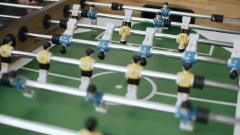 Friends having fun together playing table football. 4k Stock Footage 97705091