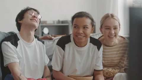 Friends Having Fun Watching TV Video stock 155446805