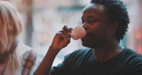 Friends having a sip of espresso Stock Footage 203582044