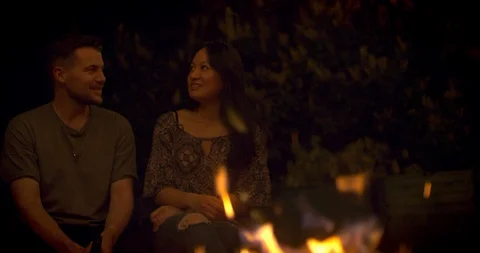 Friends having a talk at a fireplace Stock Footage 95328477