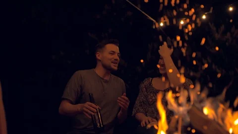 Friends having a talk at a fireplace Stock Footage 103152407