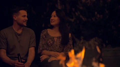 Friends having a talk at a fireplace Stock Footage 103152913