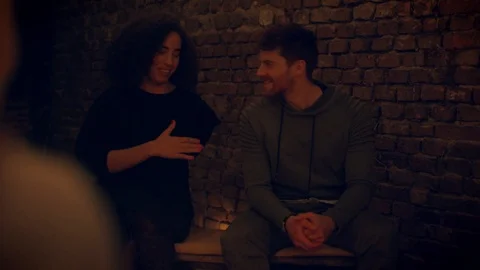 Friends having a talk at a fireplace Stock Footage 103152985