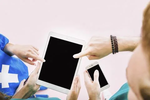 Friends holding tablet hand Stock Photos