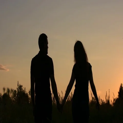 Friends jumping and having fun on sunset sky background. Stock Footage 69594425