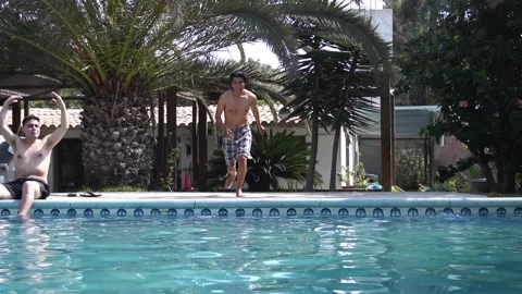 Friends jumping in the pool - Lima, Peru - September 2021 库存影片 161942795