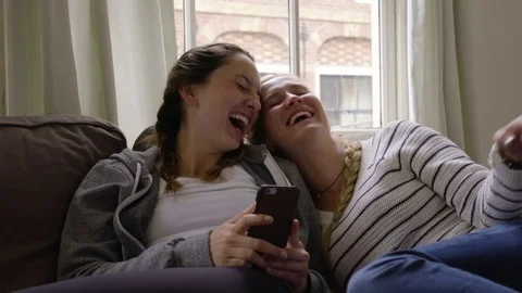 Friends Laugh Really Hard At Something Funny On Smart Phone Stock-Footage 71292797