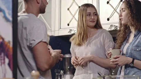 Friends Laughing while Having Tea Time Stock Footage