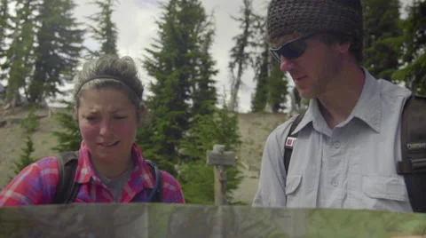 Friends look at a map smiling Stock Footage 59071019