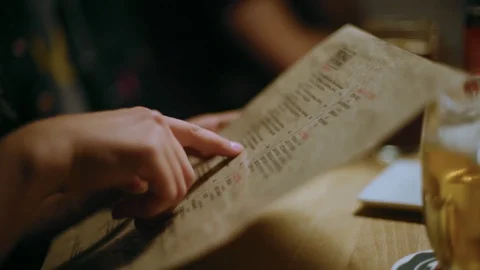 Friends look at menu to make order in restaurant Stock-Footage 105944458