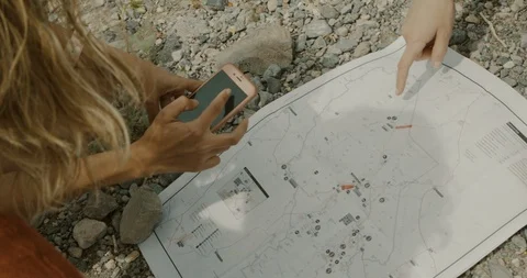 Friends looking on a map Stock Footage 114591312