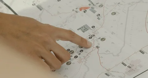 Friends looking on a map Stock Footage 114592649