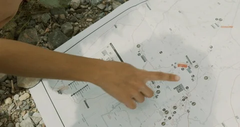 Friends looking on a map Stock Footage 114593996
