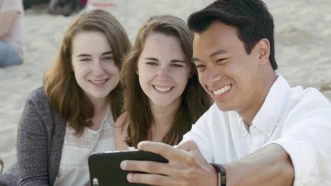 Friends making faces for selfie on the beach Stock Footage 78365652