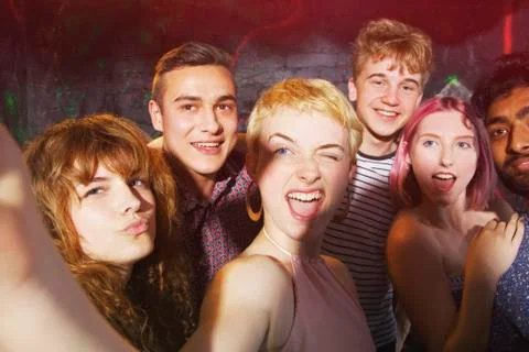 Friends making faces while taking selfie at yard Stock Photos