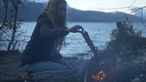 Friends making fire at the Lake Video stock 137598606