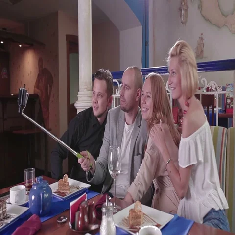 Friends making selfie with a selfie stick Stock Footage 69282963