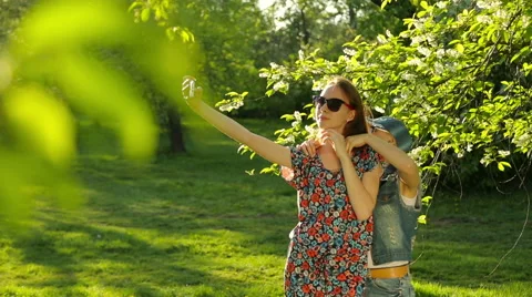 Friends making selfie. Two beautiful young women making selfie. Stock Footage 64120287