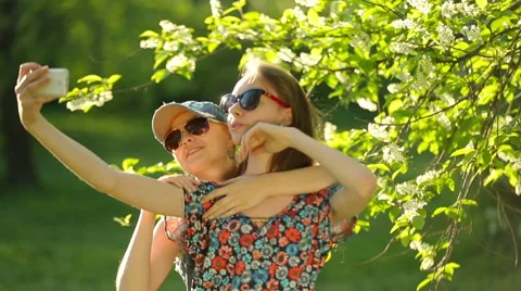 Friends making selfie. Two beautiful young women making selfie Stock Footage 64129266