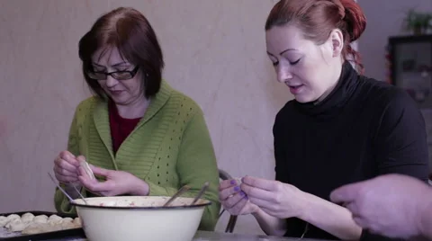 Friends mold dumplings at the table Video stock 59316319