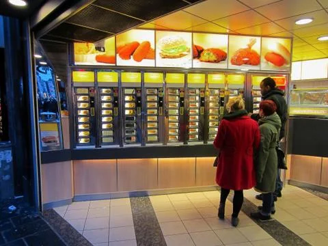 Friends Ordering at Self-Serving Fast Food Shop 写真素材