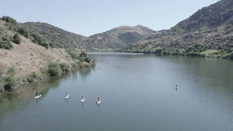 Friends paddling in a river Stock Footage 237342547