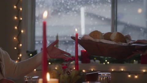 Friends Passing Bread Basket Across Christmas Table Stock Footage 208795648