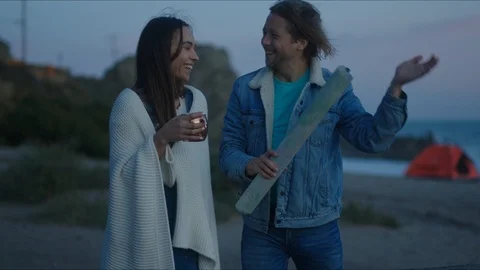 Friends plan out route in a map, chill evening at west coast Stock Footage 127409709