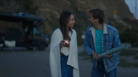 Friends plan out route in a map, chill evening at west coast Stock Footage 127409733