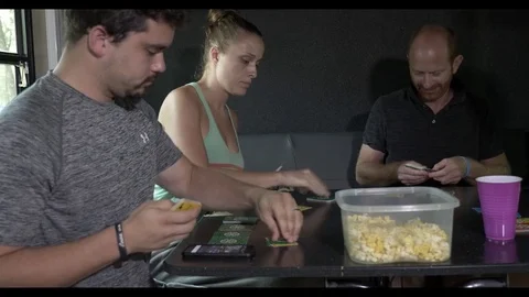 Friends Play Game and Eat Popcorn on Fifth Wheel Stock Footage
